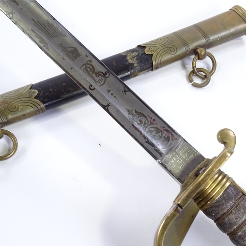 17 - An Edward VII Navy dress sword by E Goldman of Devonport, with etched blade, brass bowl hilt with sh... 