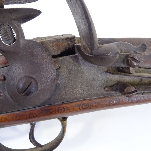 25 - An Antique Indian Flintlock Blunderbuss, with engraved barrel, lock stamped T Potts London, brass mo... 