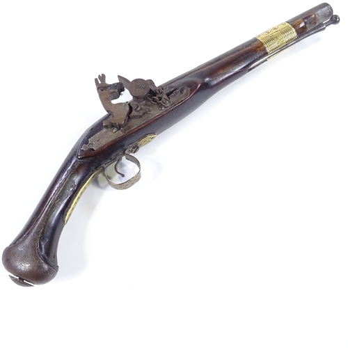 27 - A Middle Eastern Flintlock pistol, engraved barrel with engraved lock and brass mounts, length 44cm