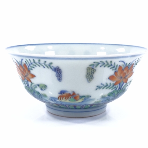 67 - A Chinese Doucai porcelain bowl, hand painted Mandarin duck design, 6 character mark, 13.5cm across,... 