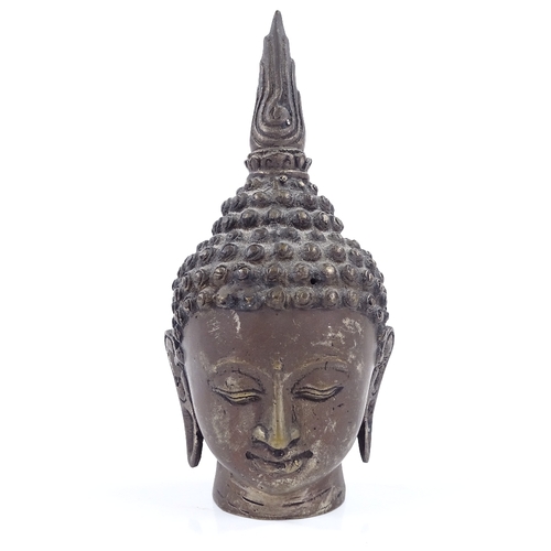 71 - An Oriental silver patinated bronze Buddha head, height 18cm