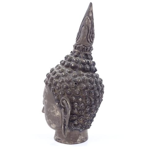 71 - An Oriental silver patinated bronze Buddha head, height 18cm