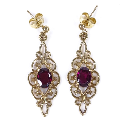 813 - A pair of 9ct gold garnet drop earrings, open wirework settings, height excluding fitting 29.2mm, 2.... 