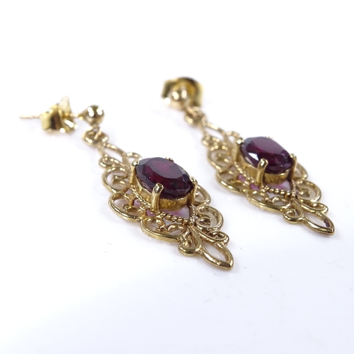 813 - A pair of 9ct gold garnet drop earrings, open wirework settings, height excluding fitting 29.2mm, 2.... 