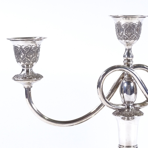 840 - An Iranian silver 2-branch 3-light candelabra, with detailed engraved and relief embossed floral dec... 