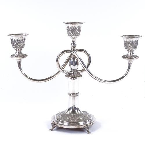 840 - An Iranian silver 2-branch 3-light candelabra, with detailed engraved and relief embossed floral dec... 