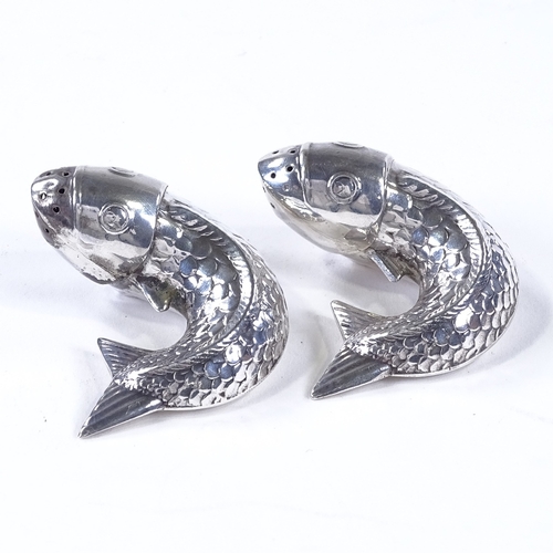 845 - A pair of Norwegian sterling silver fish pepperettes, with relief embossed decoration, width 5cm (2)