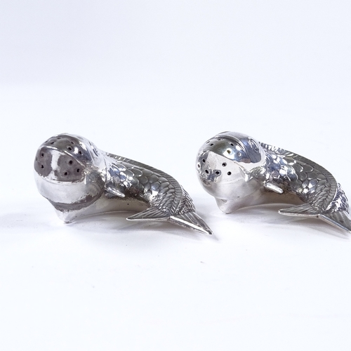 845 - A pair of Norwegian sterling silver fish pepperettes, with relief embossed decoration, width 5cm (2)