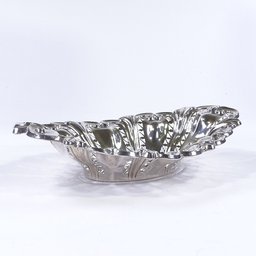 848 - A George V oval silver cake basket, with relief embossed foliate and pierced decoration, by Williams... 