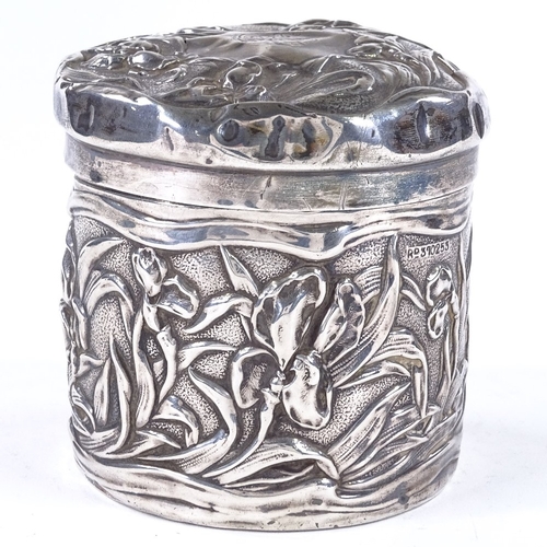 853 - An Art Nouveau Edwardian cylindrical silver lidded box, with relief embossed floral decoration, by C... 