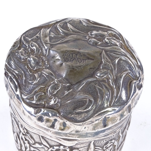 853 - An Art Nouveau Edwardian cylindrical silver lidded box, with relief embossed floral decoration, by C... 