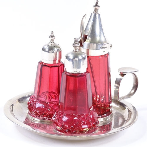 854 - A modern silver and cranberry glass cruet set, on silver fitted tray, maker's marks JW, hallmarks Bi... 