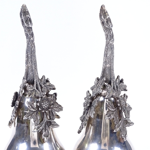 859 - A pair of Islamic silver rose water sprinklers, in the form of a pear, with cast-silver floral decor... 