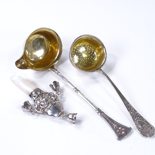 862 - A Continental silver toddy ladle, length 16cm, a Continental silver sugar sifter spoon, and an unmar... 