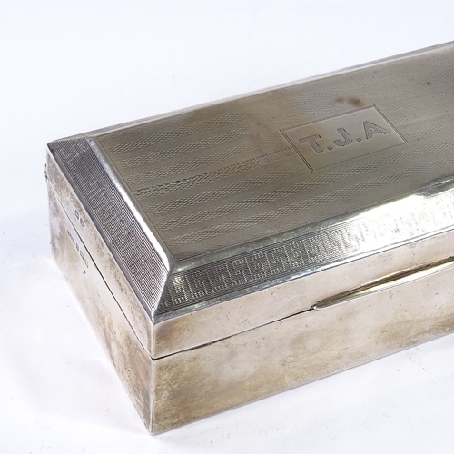 863 - A George V rectangular silver cigarette box, with engine turned lid, by F H Adams & Co, hallmarks Bi... 