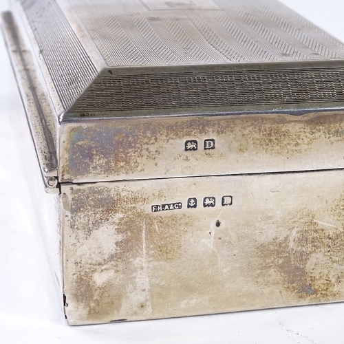 863 - A George V rectangular silver cigarette box, with engine turned lid, by F H Adams & Co, hallmarks Bi... 