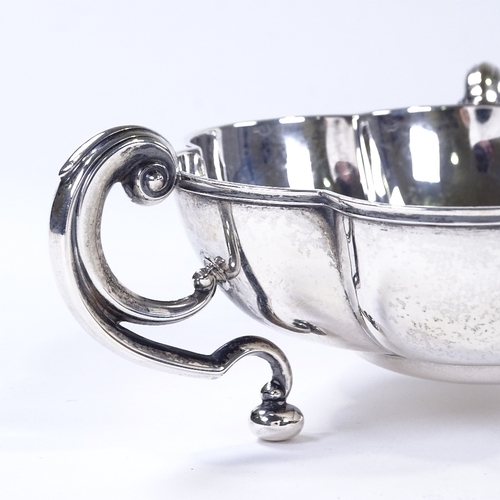 864 - An Edwardian circular silver lobed bowl, with 3 C-handles, by Horace Woodward & Co for Mappin & Webb... 