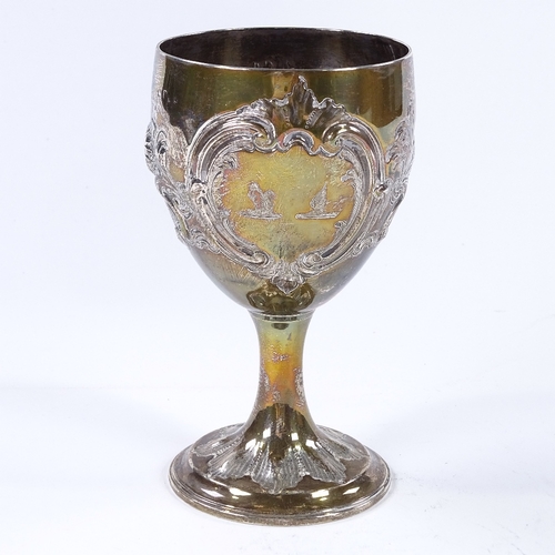 865 - A Georgian silver wine goblet, with relief embossed floral and foliate decoration, indistinct maker'... 