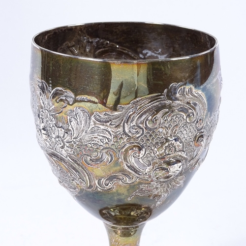 865 - A Georgian silver wine goblet, with relief embossed floral and foliate decoration, indistinct maker'... 