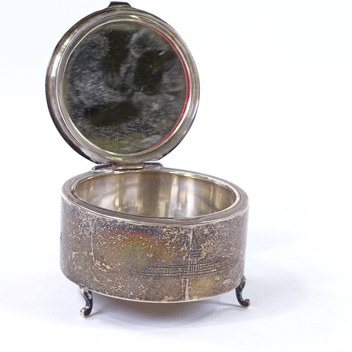 873 - An Iraqi silver circular dressing table box, with applied gold heart panel and filigree surround, di... 