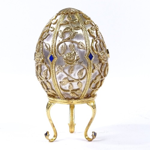 874 - A Theo Faberge style St Petersburg Collection Egg - Emergence of Spring, silver and enamel egg, open... 