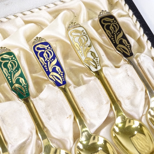 875 - A set of 6 Danish sterling silver-gilt and coloured enamel teaspoons, with stylised floral handles, ... 