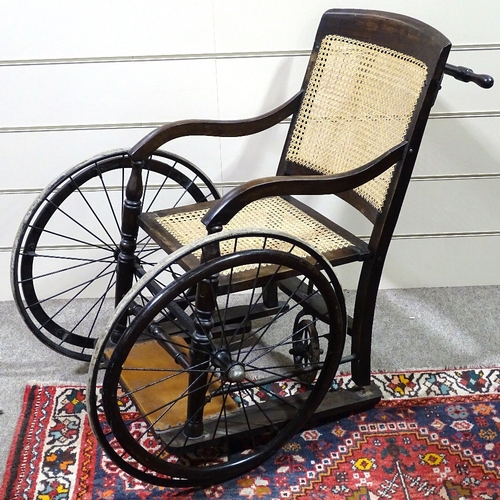 70 - An Edwardian 3 wheel invalid chair by
Harding of Bath, having a bergere back and
seat