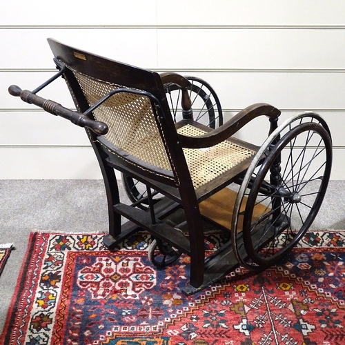 70 - An Edwardian 3 wheel invalid chair by
Harding of Bath, having a bergere back and
seat