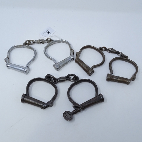 30 - **Desc change from 4 to 3** 3 pairs of Victorian steel handcuffs, one with key and stamped Hiatt