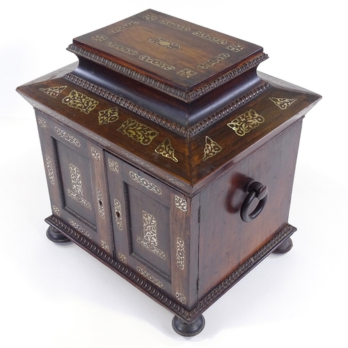 1 - A 19th century rosewood sewing cabinet, with inlaid mother-of-pearl marquetry and carved mouldings, ... 