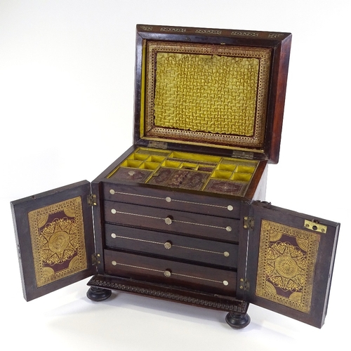 1 - A 19th century rosewood sewing cabinet, with inlaid mother-of-pearl marquetry and carved mouldings, ... 