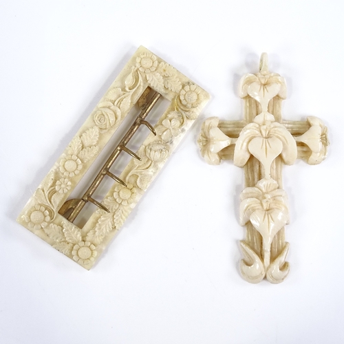 106 - A 19th century relief-carved Dieppe ivory cross pendant, length 7.5cm, and a floral carved ivory buc... 