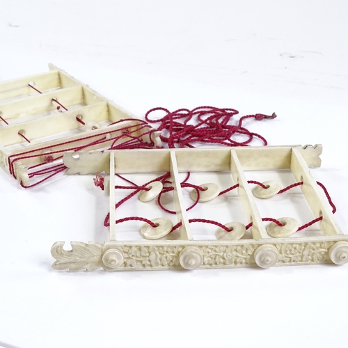 109 - 2 Chinese ivory puzzles with relief-carved sides, length 15cm