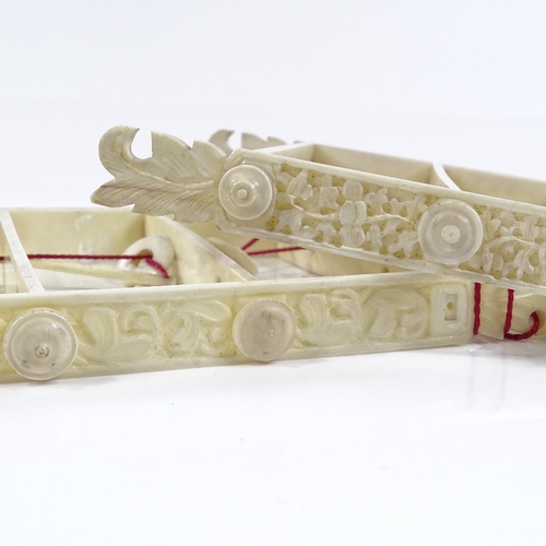 109 - 2 Chinese ivory puzzles with relief-carved sides, length 15cm