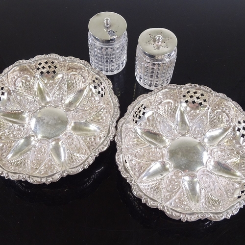 110 - A pair of pierced and embossed hallmarked silver bon bon dishes, 12cm across, and a pair of cut-glas... 