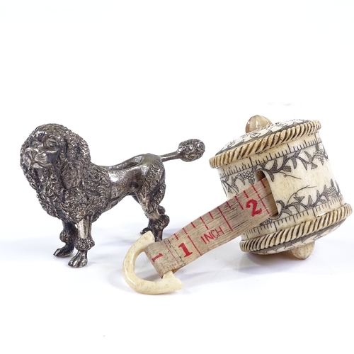 114 - An Edwardian cast-silver Poodle design pin cushion (no cushion), length 6.5cm, and an engraved bone-... 