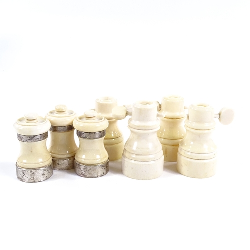 117 - 3 turned ivory pepper mills with ivory bands, height 7cm, and 4 ivory salt mills (7)