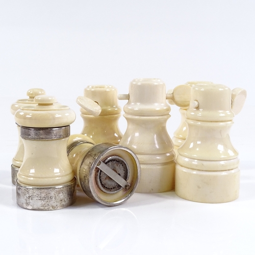 117 - 3 turned ivory pepper mills with ivory bands, height 7cm, and 4 ivory salt mills (7)