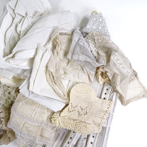 119 - A collection of Victorian lace dress ornaments, christening gowns, a lace-trimmed bodice etc