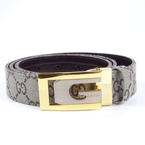 124 - A Gucci leather belt, new and boxed condition