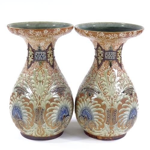 133 - Frank Butler for Doulton Lambeth, a pair of large stoneware vases with incised and painted decoratio... 