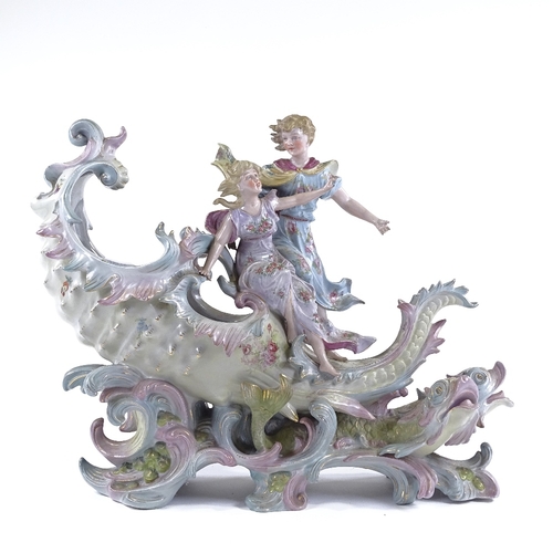 135 - A porcelain table centre bowl in the form of 2 children riding a seashell, length 36cm