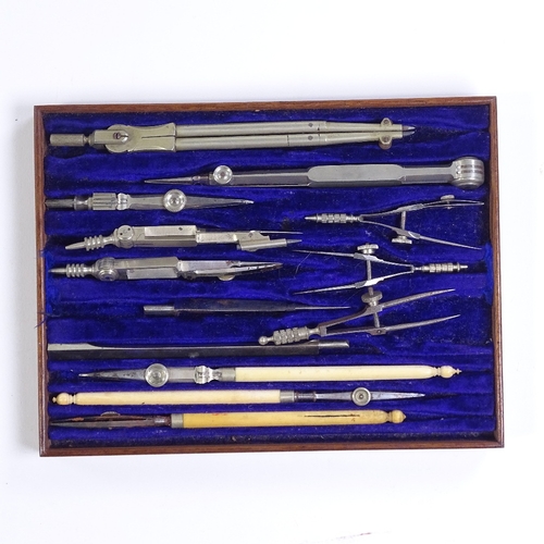 137 - A Victorian walnut-cased set of draughtsman's drawing instruments, length 20cm, and a mahogany-cased... 