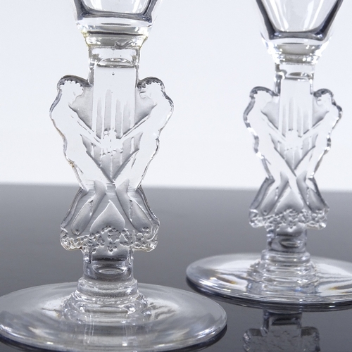 23 - Rene Lalique set of 3 glasses with funnel-shaped bowls and moulded Classical figure design stems, he... 