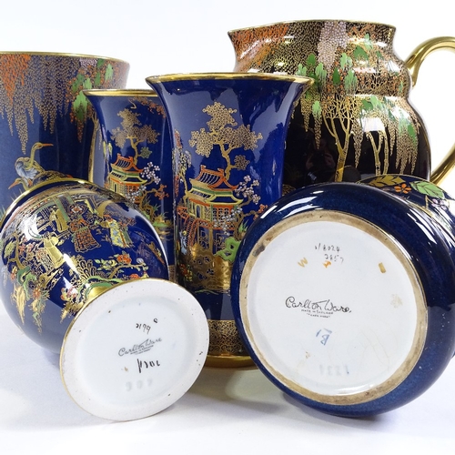 62 - 6 pieces of Carlton Ware Bleu Royale, including a large Heron design gilded jug, height 20cm (6)