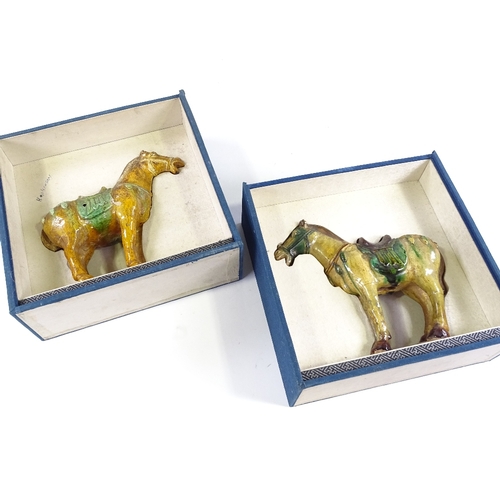 69 - A pair of Chinese Tang style green/brown glaze terracotta horses, height 20cm, in silk-lined boxes (... 