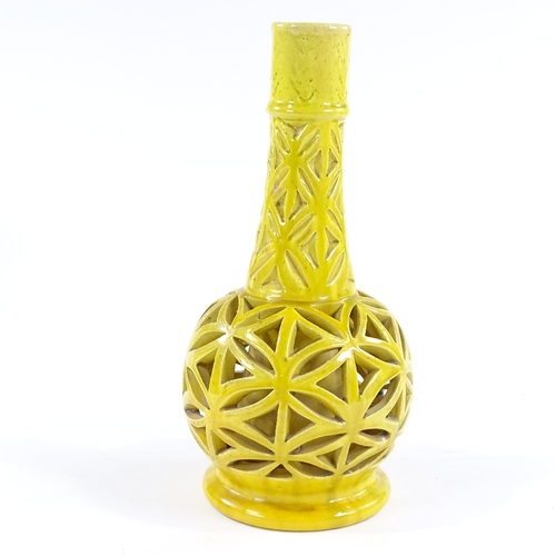 73 - A yellow glazed reticulated pottery vase, unsigned, height 33cm