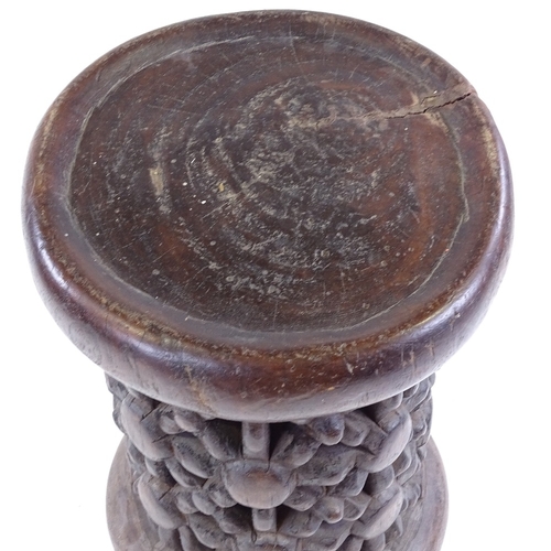 80 - A Cameroon Tribal carved and pierced wood spider design stool, height 37cm, diameter 26cm