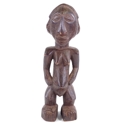 81 - A Baule carved and stained wood Ancestor figure, height 34cm