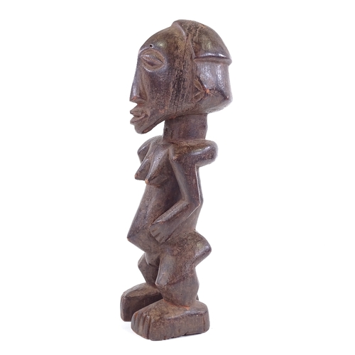 81 - A Baule carved and stained wood Ancestor figure, height 34cm